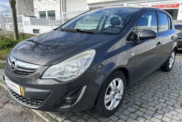 Opel Corsa 2013 - 7750 EUR, 99853 km - AUTO.MOTO.pt - 99853km - foto 14 de 15