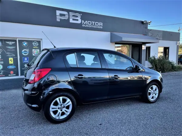 Opel Corsa 2013 - 9750 EUR, 171082 km - AUTO.MOTO.pt - 171082km - foto 7 de 12